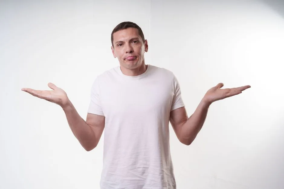 Person shrugging with an uncertain expression