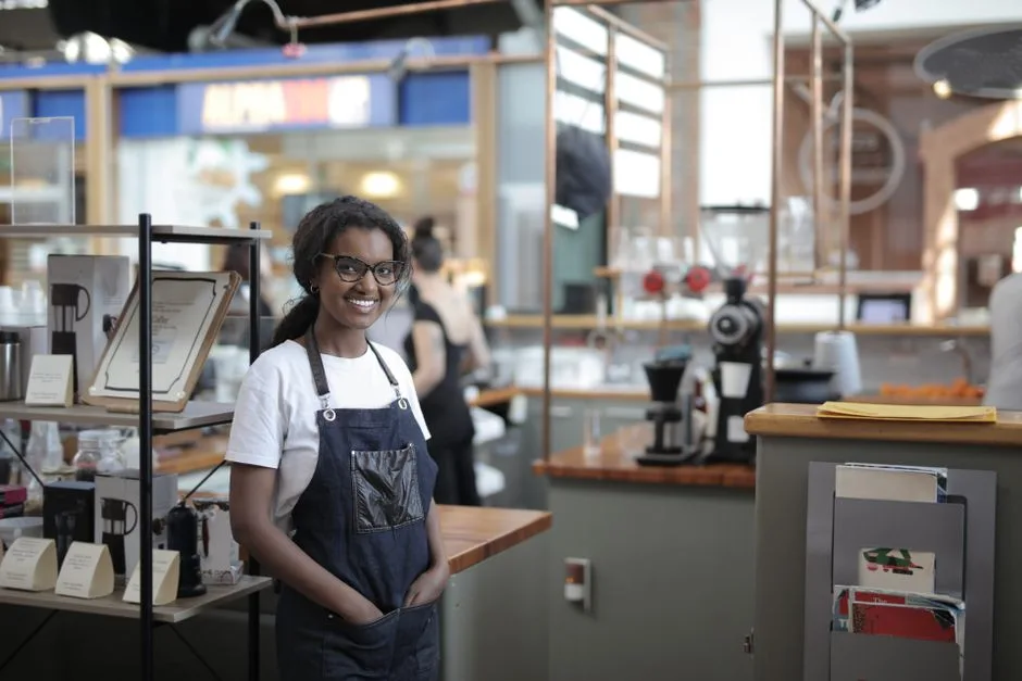 Small business owner behind a shop counter