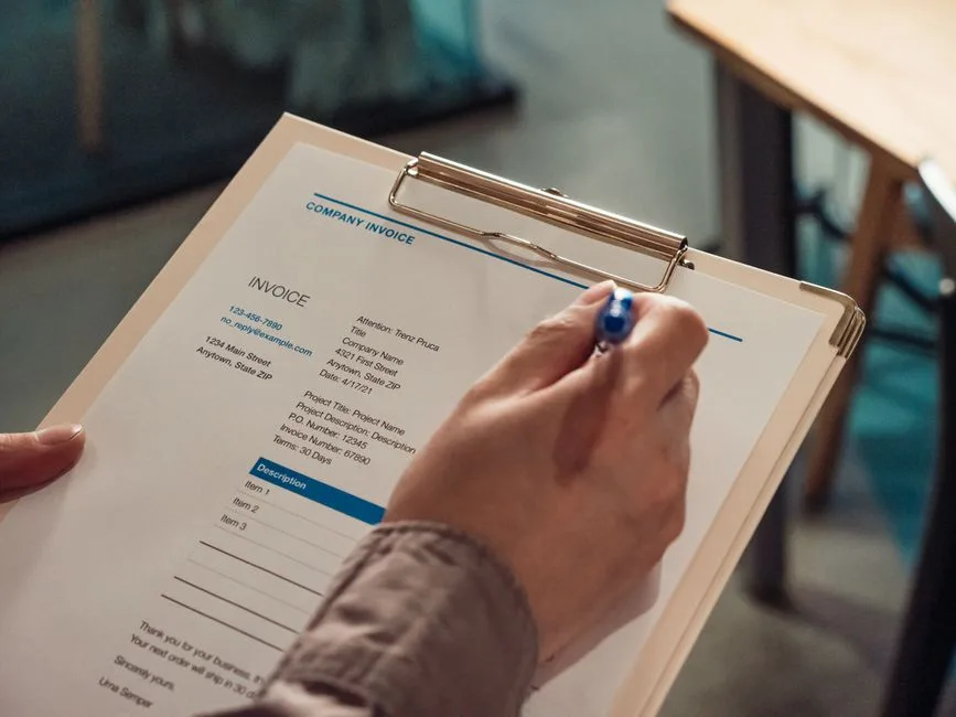 Overdue invoice documents on a desk