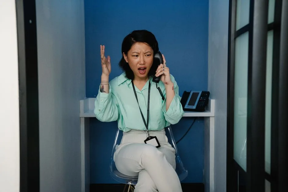 Person making a phone call from an office