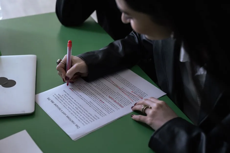Document being edited with a red pen