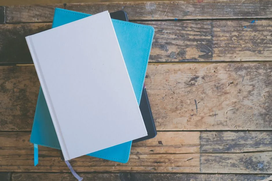 Stack of blank colorful notebooks