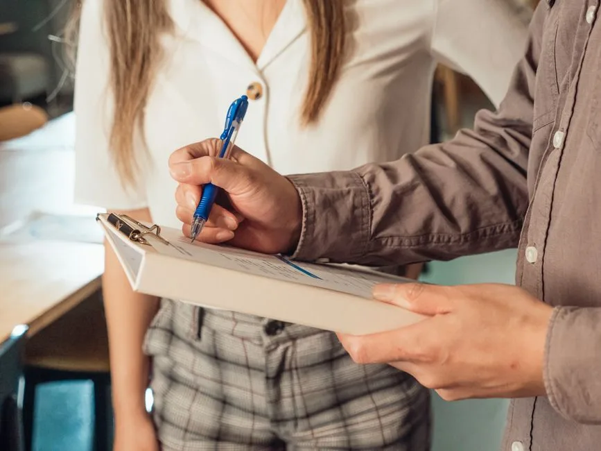 Checklist on a clipboard being reviewed