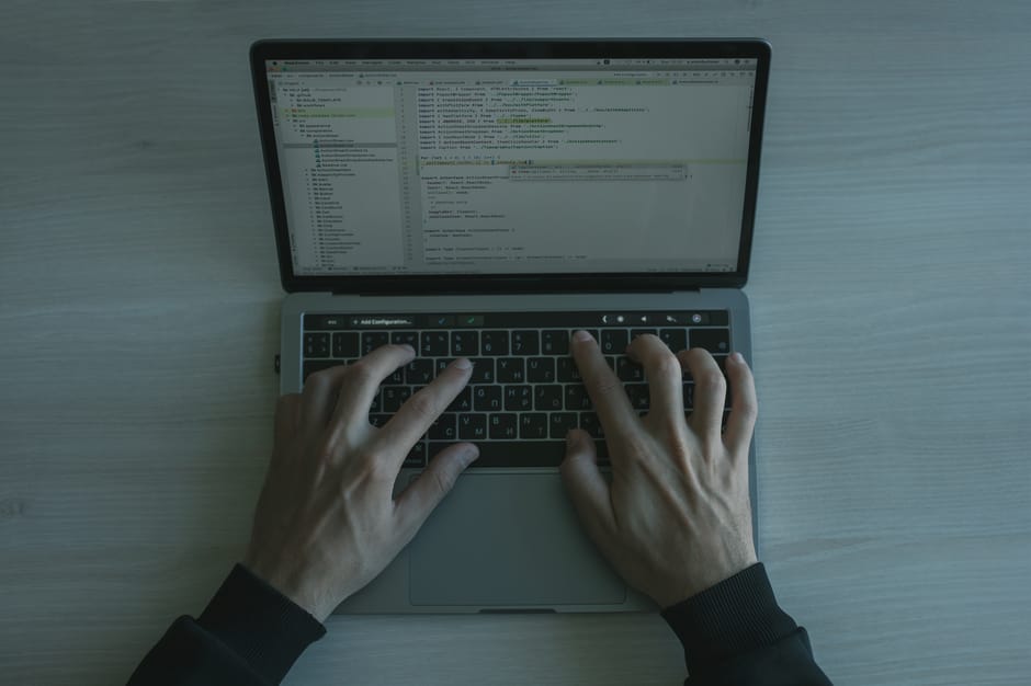 Developer working with API configuration on a laptop