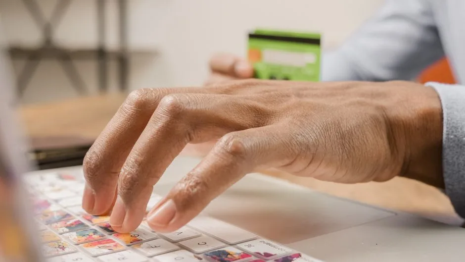 Person typing a password on a keyboard